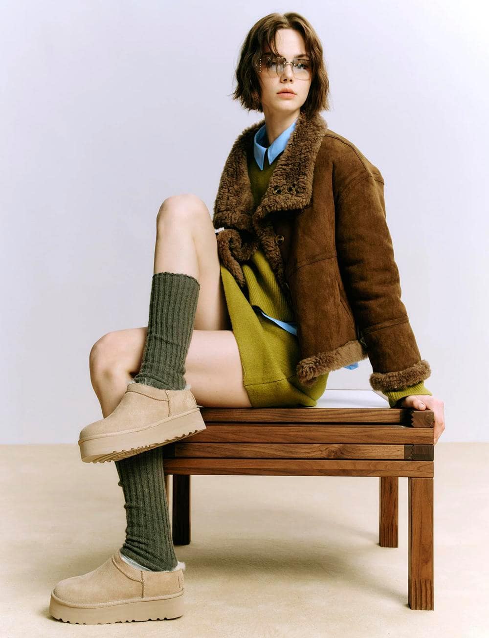 Girl sitting wearing uggs